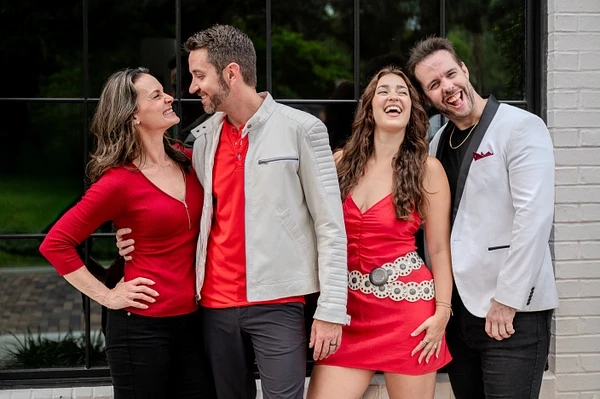 Jessica Lorion, Jeff Grider, Jaime Arin, and Chris Rupp laughing together in red and silver outfits