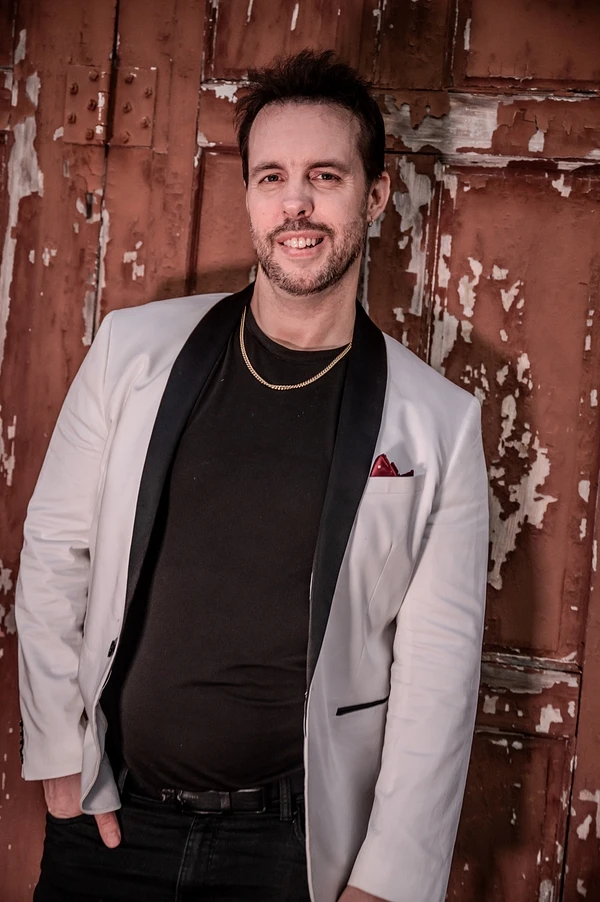 Chris Rupp in a silver jacket